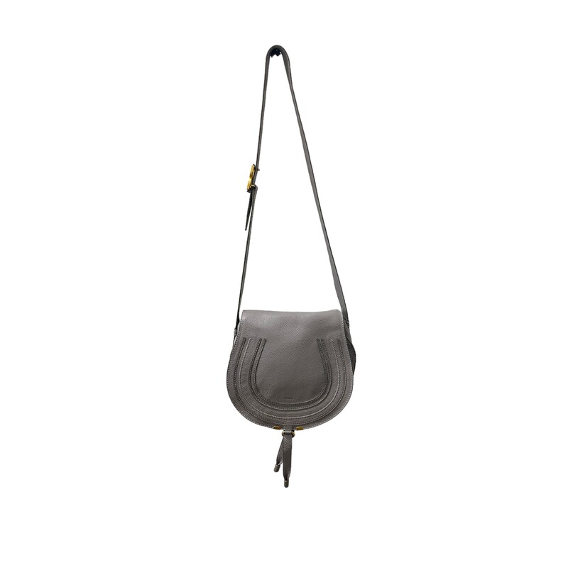 Chloe Marcie Crossbody

Curvaceous detailing and golden hardware ornament the saddle-shaped flap of a crossbody bag crafted from sumptuous grained leather in a spacious silhouette.

Magnetic-snap flap closure
Adjustable crossbody strap
Interior wall pocket; slip pocket beneath flap
Structured silhouette with flat base for stability
Linen lining
Leather
Made in Italy

Dimensions:
Base length: 11 in
Height: 10 in
Width: 4 in
Drop: 17 in