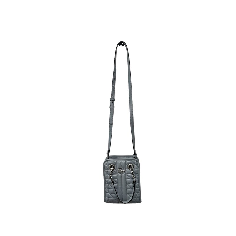 GUCCI Calfskin Matelasse Aria Mini GG Marmont Tote in Deep Grey. This tote bag is crafted of smooth and supple calfskin leather in grey. This bag features leather top handles, an optional shoulder strap, and silver hardware. The top is open to a beige fabric interior with a central zipper compartment and zipper and patch pockets.

Dimensions:
Base length: 6.25 in
Height: 7.50 in
Width: 3.00 in
Drop: 4.25 in
Drop: 17.00 in