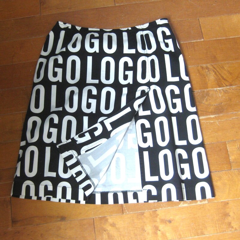 bold pencil skirt<br />
made in Italy by Moschino Jeans.<br />
Black and white with large letters spelling out LOGO<br />
98% Cotton , 2% spandex<br />
marked size 8<br />
flat measurements:<br />
waist: 14 3/8<br />
hip: 20<br />
length: 21.5<br />
<br />
very good condition,<br />
please see the close up of the back of the skirt, the middle seam appears to be a little bit strained but it's strong and sound, might have been like this since it was new.<br />
<br />
Thanks for looking!<br />
#74543