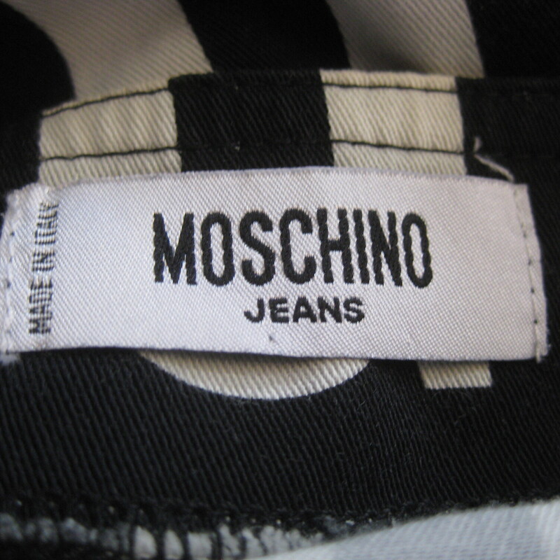 bold pencil skirt<br />
made in Italy by Moschino Jeans.<br />
Black and white with large letters spelling out LOGO<br />
98% Cotton , 2% spandex<br />
marked size 8<br />
flat measurements:<br />
waist: 14 3/8<br />
hip: 20<br />
length: 21.5<br />
<br />
very good condition,<br />
please see the close up of the back of the skirt, the middle seam appears to be a little bit strained but it's strong and sound, might have been like this since it was new.<br />
<br />
Thanks for looking!<br />
#74543