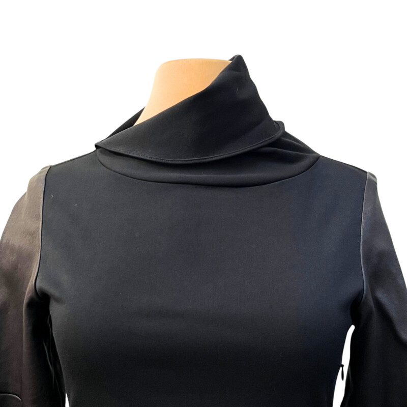 Iga Dress<br />
Leather Sleeves<br />
Mock Neck<br />
Great Stretch in Fabric<br />
Retails for over $800.00<br />
Black<br />
Size: 2