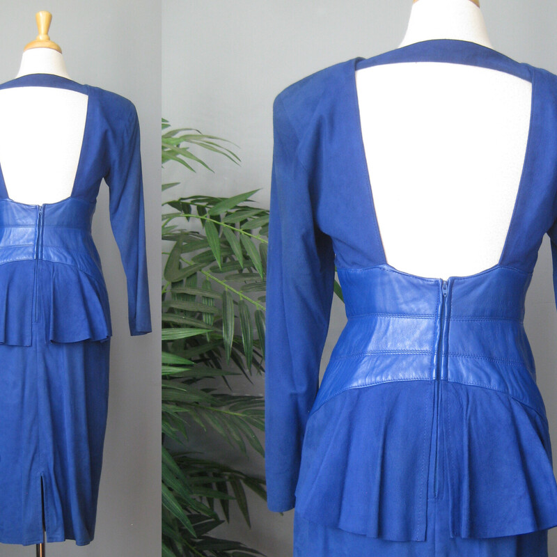 Vtg Vakko Suede, Royal Bl, Size: 10<br />
Stunning! Softest kid suede dress. Royal blue with leather wide corset band at waist.<br />
Slim Pencil skirt<br />
long sleeves<br />
Bustly peplum at the low cut open back.<br />
A suede band at the back of the neck.<br />
Fully Lined.<br />
Shoulder pads inside lining.<br />
The suede and leather is of the very high quality which Vakko is known for.<br />
<br />
CONDITION: Excellent condition with very minor fading at the left seam, probably where it was exposed to light in it's former closet. Also one dark spot on the back. Also, the lining is discolored in some areas from the former wearer's body.<br />
<br />
LABEL: Vakko, made USA<br />
SIZE: Marked size 10, BUT it fits much smaller. Fits like a modern smallish size 4.<br />
PLEASE see measurements provided and compare to a similar garment of your own, allow an inch or so for differences in measuring techniques. Reach out if you need help, I'm good at helping people figure out fit! :)<br />
<br />
Flat measurements:<br />
Shoulder to shoulder: 17<br />
Armpit to armpit - about 15.75 (bc of the construction of the dress with cut on sleeves, it's a little hard to get an accurate here. I wouldn't worry too much about this measurement unless you are very large busted.)<br />
Waist, flat at center of leather - about 14.<br />
Hip: 19.25<br />
Vent is about 6<br />
Underarm sleeve seam:- about 17<br />
Length : 44<br />
<br />
thanks for looking!<br />
#71243