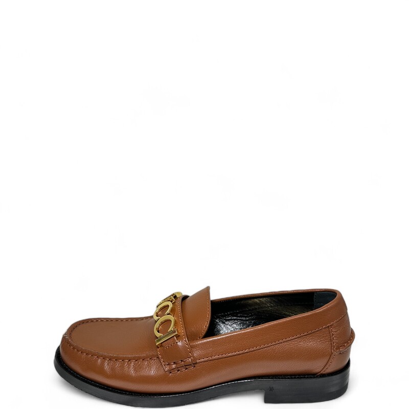 Gucci Cara Logo Loafers, Brown, Size: 38
Round moc-stitch toe
Slip on
Logo hardware and strap detail at instep
Leather upper, lining and sole
Made in Italy