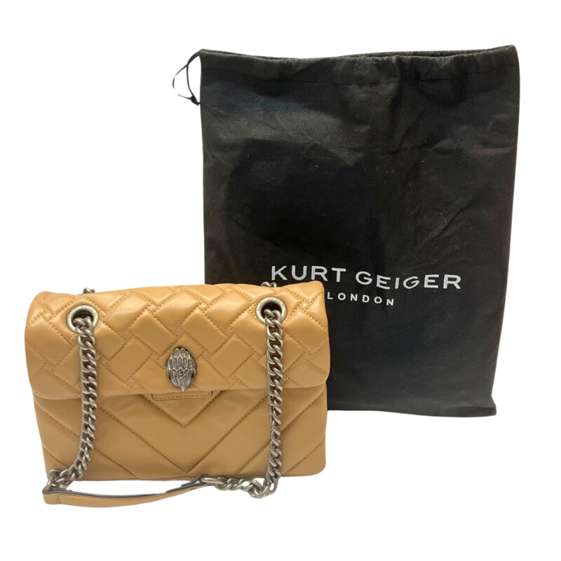 Kurt Geiger Kensington Handbag<br />
Quilted with Chain Strap<br />
2 Magnetic Snap Closures and Interior Wall Pocket<br />
Eagle Head Jewel Detail for Closure<br />
100% Leather<br />
Color: Warm Beige