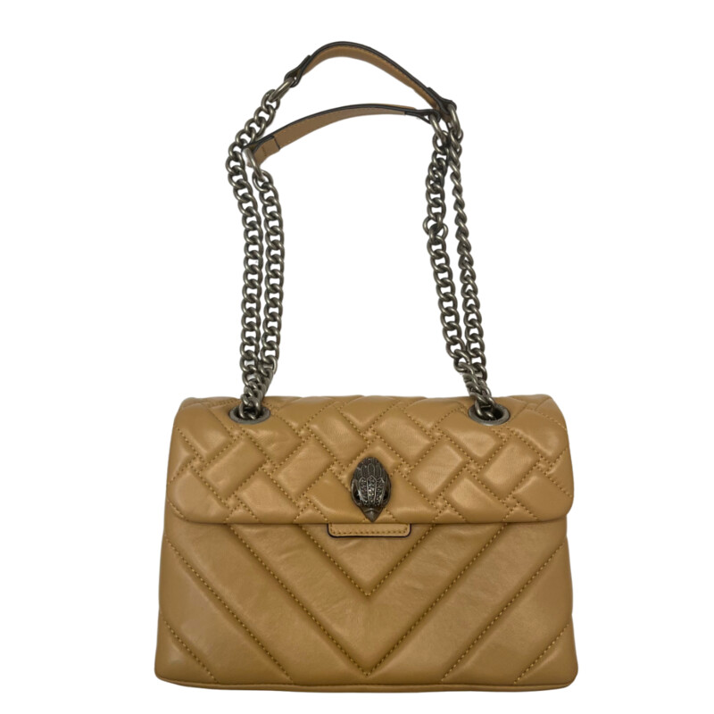 Kurt Geiger Kensington Handbag<br />
Quilted with Chain Strap<br />
2 Magnetic Snap Closures and Interior Wall Pocket<br />
Eagle Head Jewel Detail for Closure<br />
100% Leather<br />
Color: Warm Beige