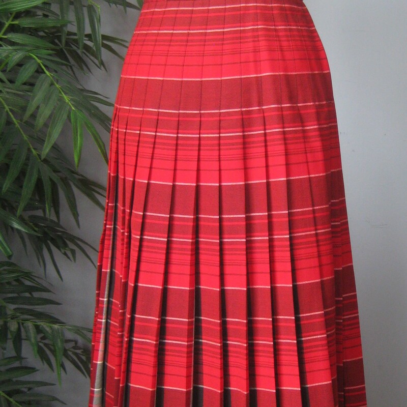 Here's a vintage Pendleton Skirt in a bright red plaid.<br />
It's reversible!<br />
100% Wool<br />
Made in Oregon in the USA<br />
<br />
The skirt has knife pleats all around, the pleats are sewn down from the waist to the hips.<br />
Metal two way zipper and two button closure.<br />
Unlined.<br />
Marked size 8<br />
Here are the flat measurements, please double where appropriate:<br />
Waist: 14.75<br />
Hips: 22<br />
Length: 27<br />
<br />
Thanks for looking<br />
#75017