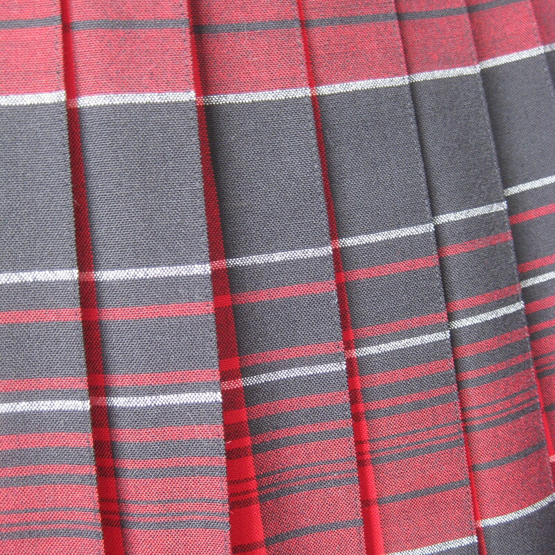 Here's a vintage Pendleton Skirt in a bright red plaid.<br />
It's reversible!<br />
100% Wool<br />
Made in Oregon in the USA<br />
<br />
The skirt has knife pleats all around, the pleats are sewn down from the waist to the hips.<br />
Metal two way zipper and two button closure.<br />
Unlined.<br />
Marked size 8<br />
Here are the flat measurements, please double where appropriate:<br />
Waist: 14.75<br />
Hips: 22<br />
Length: 27<br />
<br />
Thanks for looking<br />
#75017