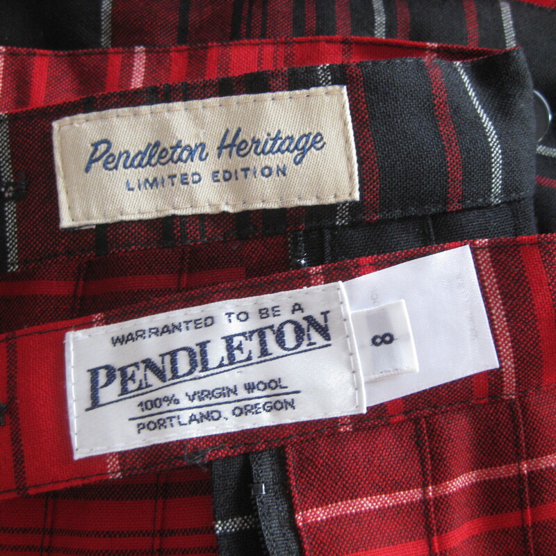 Here's a vintage Pendleton Skirt in a bright red plaid.<br />
It's reversible!<br />
100% Wool<br />
Made in Oregon in the USA<br />
<br />
The skirt has knife pleats all around, the pleats are sewn down from the waist to the hips.<br />
Metal two way zipper and two button closure.<br />
Unlined.<br />
Marked size 8<br />
Here are the flat measurements, please double where appropriate:<br />
Waist: 14.75<br />
Hips: 22<br />
Length: 27<br />
<br />
Thanks for looking<br />
#75017