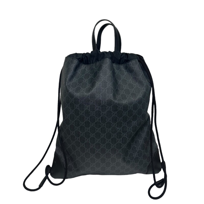 GUCCI Soft GG Supreme Monogram Appia Calfskin Web Drawstring Backpack in Black. This stylish backpack is crafted of Gucci GG monogram coated canvas with black leather corners. The shoulder bag features black leather top handles and interior trim, and black side cable cording. This side cording gathers around the top to cinch the backpack closed and opens to a spacious black nylon fabric interior with a zipper pocket.<br />
Dimensions:<br />
Base length: 15 in<br />
Height: 17.75 in<br />
Width: 0.75 in<br />
Drop: 3 in<br />
Drop: 18 in