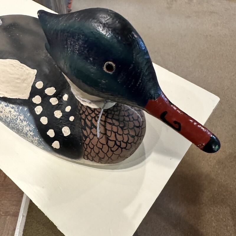 Hand Painted Wood Duck
Base Size:  13in x 5.5in.
Vtg. wooden Merganser duck hand painted with
glass eyes.  Nice and solid!