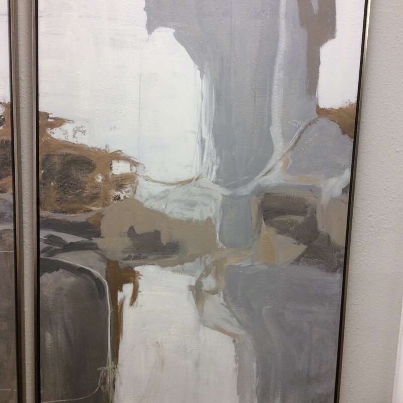 This large Abstract Print has a muted palette of grays and whites with a sleek contemporary frame.