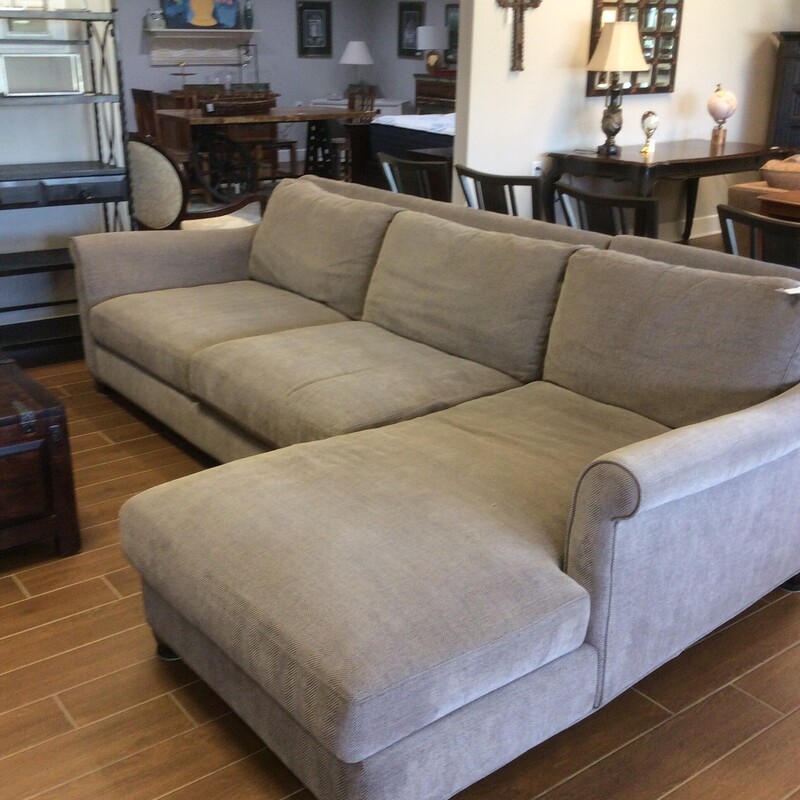 This Sherson Sofa with Chaise is upholstered in a soft neutral fabric.
