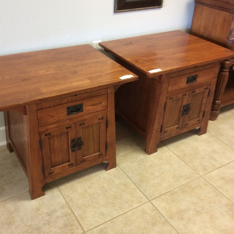 This pair of Arts and Crafts style End Tables are made of solid oak with black metal hardware.