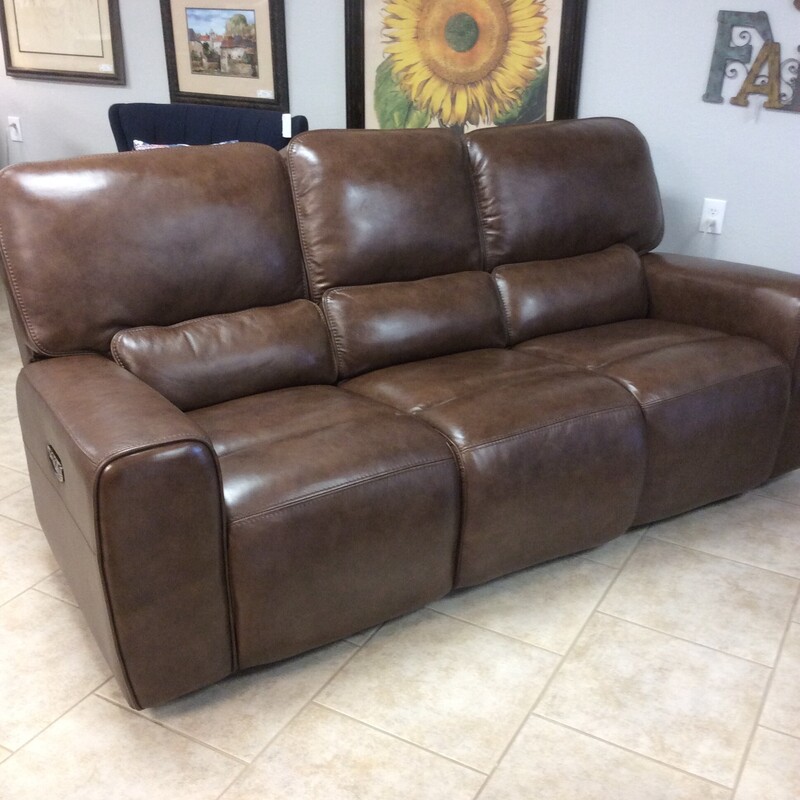 This Recliner Sofa is covered in Brown leather with a stitched detail.