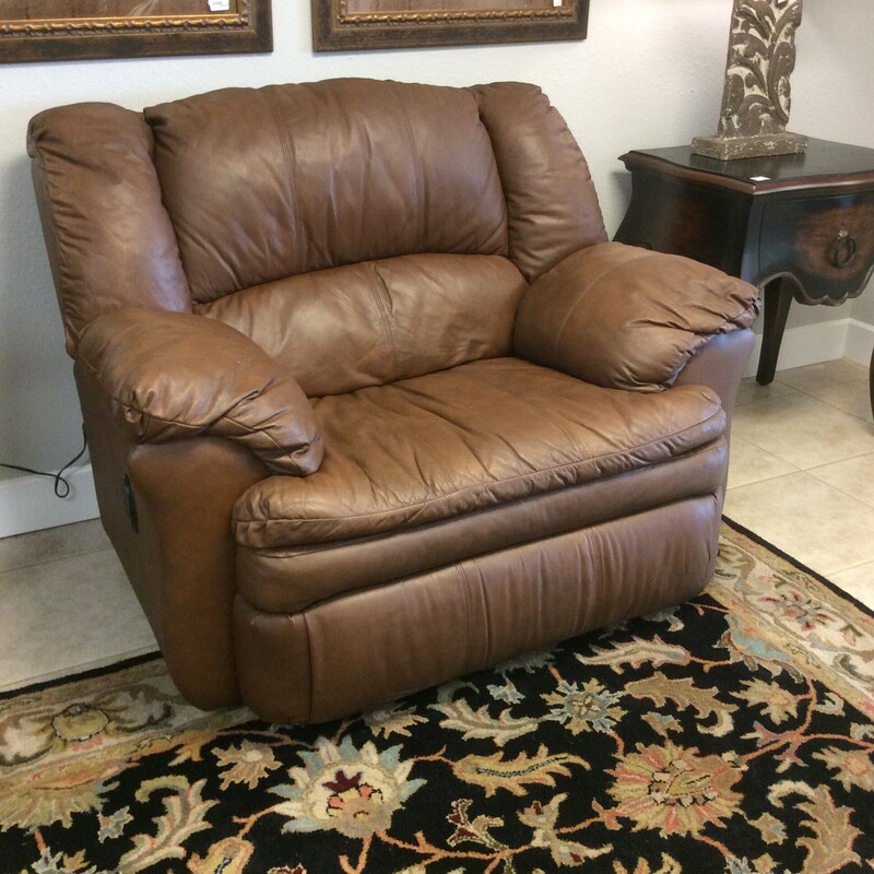 This large, cushy, Manual  Recliner, has  Brown Leather upholstery