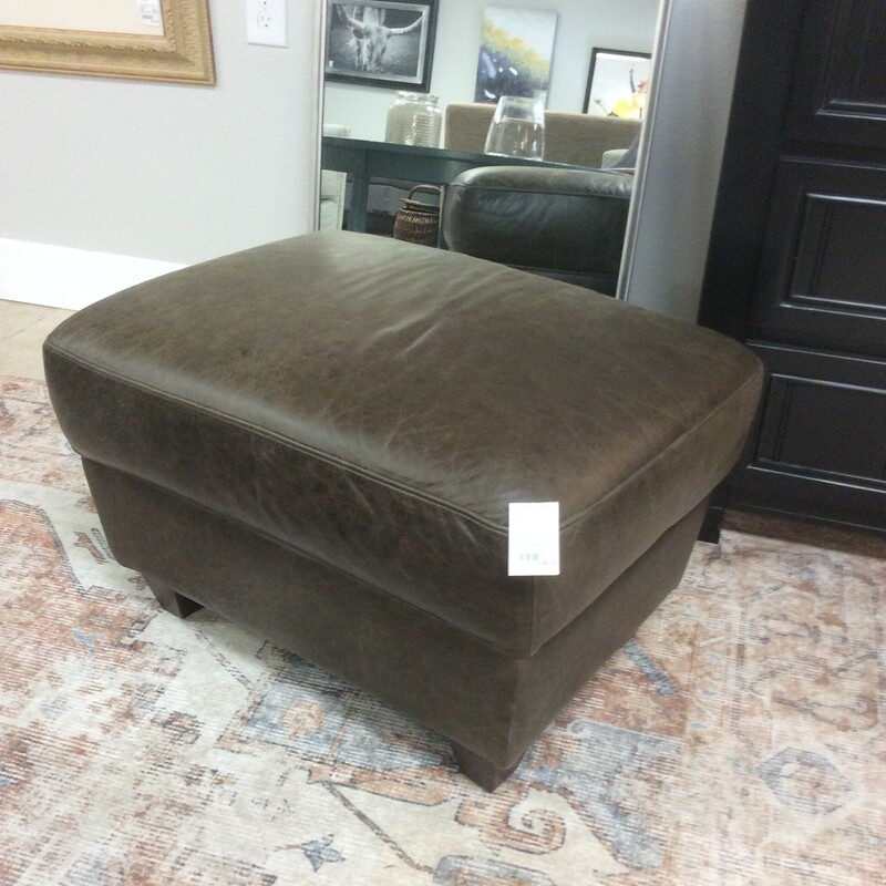 This is an Italian Leather Ottoman in Brown.