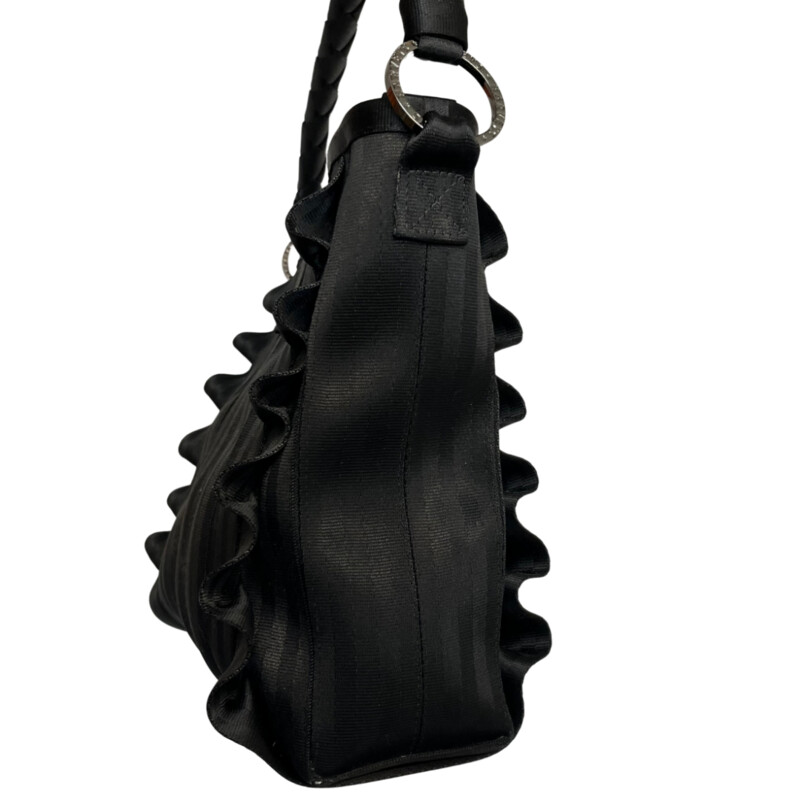 New Harveys Lola Hobo Handbag
Amazing Bag made from recycled seatbelts
Ruffle detail on front and back
Braided shoulder strap
Buckle closure
Gunmetal gray/ silver hardware features Harvey's logos
interior features 3 compartments, side zip pocket, side pouches and a center zipper close pocket
Harveys logo print interior in black
Color: Black
Retails for $238.00