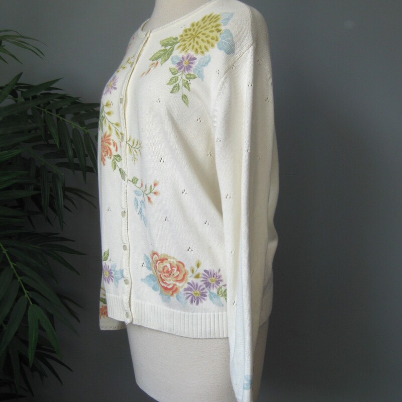 This is a white cotton/acrylic blend cardigan made in Korea.  It has painted flowers growing on all up and down the front, the hem and ends of the sleeves and one of the shoulders in the back.  Some of the flowers have a bit of beading sewn on.   It buttons closed with shaped pearlized buttons.
It's marked size L, should fit pretty true but make sure using the measurements provided.
Here are the flat measurements, please double where appropriate
Shoulder to shoulder: 17.25
Armpit to Armpit: 22.5
Width at bottom: 20
Length: 24
Underarm sleeve seam length: 16.25
Excellent condition, no flaws!
thanks for looking.
#74875