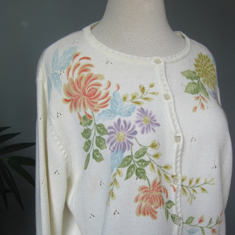 This is a white cotton/acrylic blend cardigan made in Korea.  It has painted flowers growing on all up and down the front, the hem and ends of the sleeves and one of the shoulders in the back.  Some of the flowers have a bit of beading sewn on.   It buttons closed with shaped pearlized buttons.<br />
It's marked size L, should fit pretty true but make sure using the measurements provided.<br />
Here are the flat measurements, please double where appropriate<br />
Shoulder to shoulder: 17.25<br />
Armpit to Armpit: 22.5<br />
Width at bottom: 20<br />
Length: 24<br />
Underarm sleeve seam length: 16.25<br />
Excellent condition, no flaws!<br />
thanks for looking.<br />
#74875