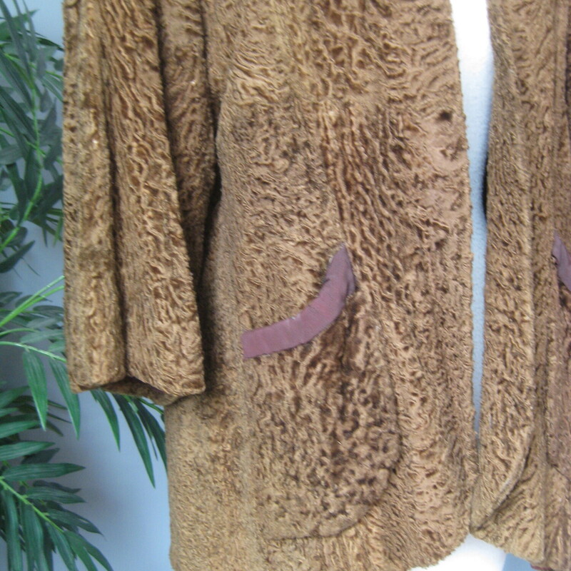 Vtg P Lamb Swing, Brown, Size: None<br />
This is a brown persian lamb jacket with a tacked on mink fur collar.<br />
It's very old, and heavy - I would guess its from the 1940s, and funky but very fun.<br />
It have a swing shape, 3/4 sleeves and the former owner sewed a mink collar on it. This collar is stitched only at the two ends, you could easily remove it or have me remove it for you or you can easily have it more fully attached if you like that look.<br />
Fully lined in an old style lining, with the former owners initial embroidered inside.<br />
<br />
armpit to armpit 25<br />
Length: 29<br />
<br />
It's in good shape, old and honestly a tiny bit musty, but for a fun night out it would keep you warm and turn heads!<br />
<br />
Thanks for looking!<br />
#70441