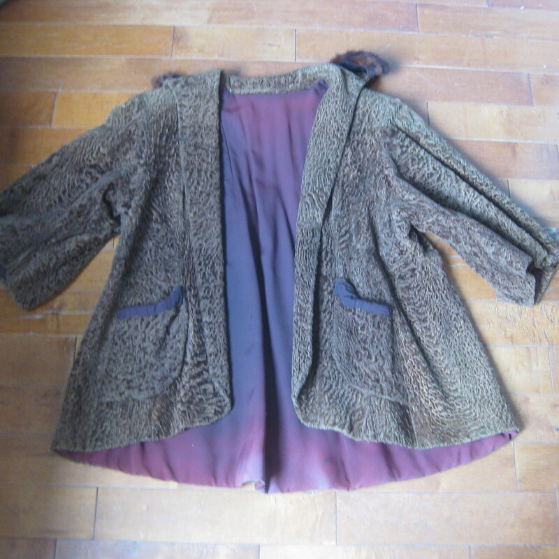 Vtg P Lamb Swing, Brown, Size: None<br />
This is a brown persian lamb jacket with a tacked on mink fur collar.<br />
It's very old, and heavy - I would guess its from the 1940s, and funky but very fun.<br />
It have a swing shape, 3/4 sleeves and the former owner sewed a mink collar on it. This collar is stitched only at the two ends, you could easily remove it or have me remove it for you or you can easily have it more fully attached if you like that look.<br />
Fully lined in an old style lining, with the former owners initial embroidered inside.<br />
<br />
armpit to armpit 25<br />
Length: 29<br />
<br />
It's in good shape, old and honestly a tiny bit musty, but for a fun night out it would keep you warm and turn heads!<br />
<br />
Thanks for looking!<br />
#70441