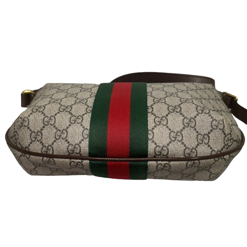 Gucci OPHIDIA GG SMALL CROSSBODY<br />
Beige/ebony soft GG Supreme, crafted from a coated microfiber fabric, with brown leather trim<br />
Green and red Web<br />
Antique gold-toned hardware<br />
Double G<br />
Interior zipper pocket<br />
Adjustable leather shoulder strap with 16.9 drop<br />
Zipper closure<br />
Small size: 11.8W x 8.7H x 2.2D<br />
Made in Italy