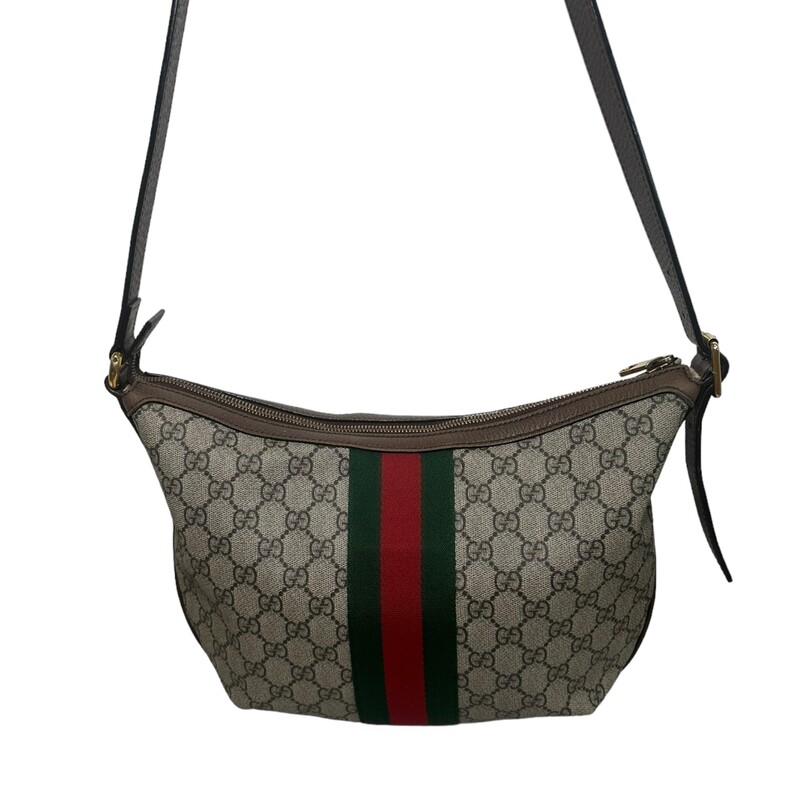 Gucci OPHIDIA GG SMALL CROSSBODY<br />
Beige/ebony soft GG Supreme, crafted from a coated microfiber fabric, with brown leather trim<br />
Green and red Web<br />
Antique gold-toned hardware<br />
Double G<br />
Interior zipper pocket<br />
Adjustable leather shoulder strap with 16.9 drop<br />
Zipper closure<br />
Small size: 11.8W x 8.7H x 2.2D<br />
Made in Italy