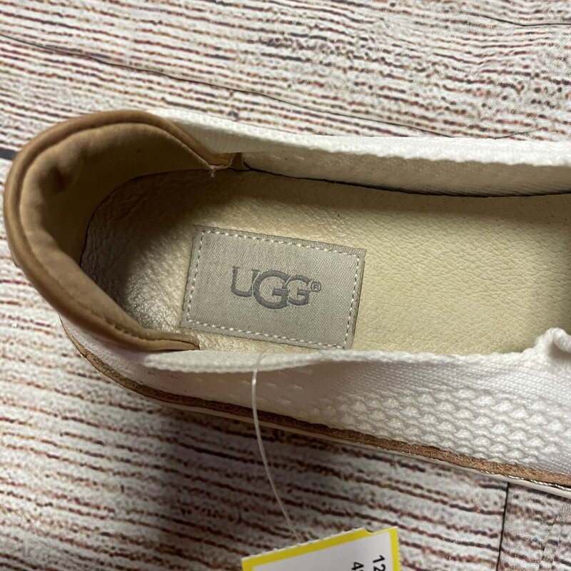 UGG slip on shoes off white with tan leather trim. Size 7.5