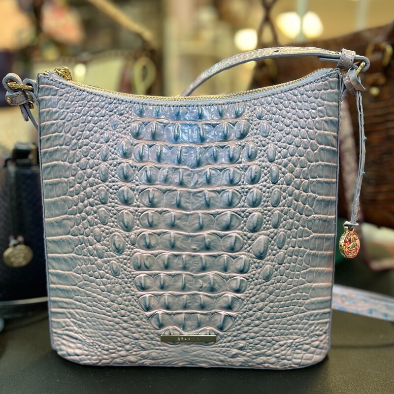 BRAHMIN
Katie Crossbody Frosted Lilac Melbourne Purse
The Katie Crossbody is a zip-top style that tapers out slightly to create a sleek silhouette. Adjust the strap to fit your needs, and stay organized with multiple interior pockets and a key clip.
Zip top
Back slide-in pocket
Interior organizer pockets
Pen pocket
Key clip
25 inch strap drop
This bag is in like new condition.  No marks, flaws, or scratches.