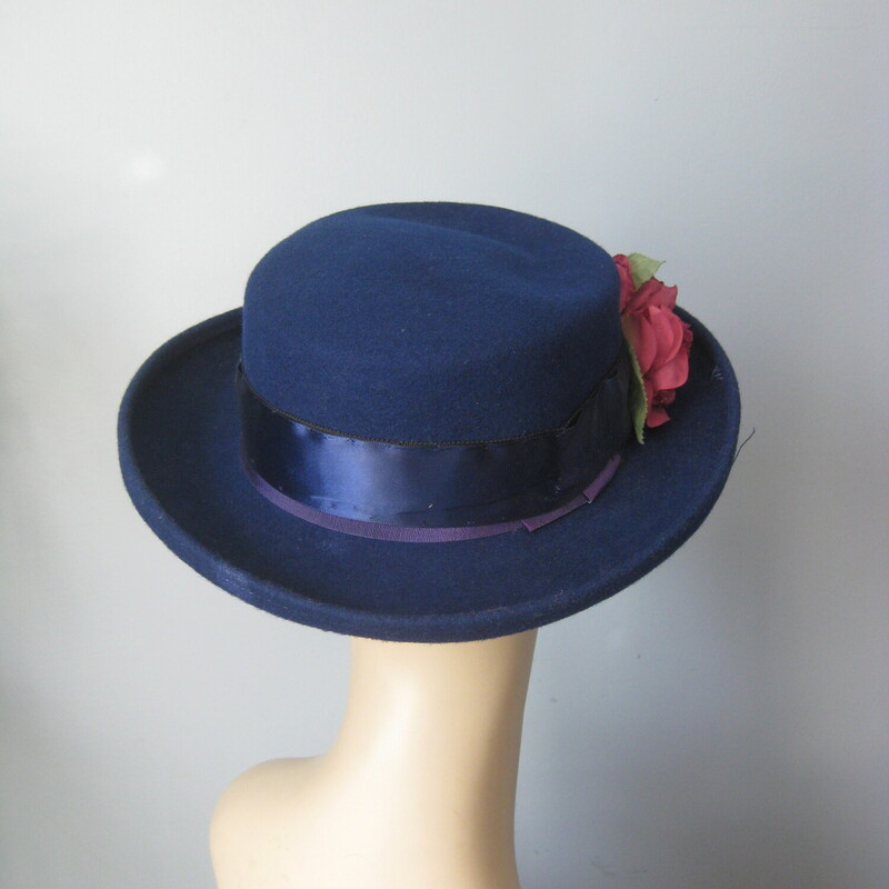 Wool felt hat with bit of brim and romantic colorful fabric flowers and wide ribbon.
Made in the USA

Excellent vintage condition!

This hat is a little big for my mannequin, she has a small head, this should fit a medium to large womans head nicely.

Inner hat band: 21.5

Thanks for looking!
#76836