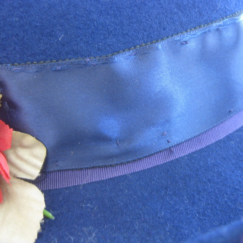 Wool felt hat with bit of brim and romantic colorful fabric flowers and wide ribbon.<br />
Made in the USA<br />
<br />
Excellent vintage condition!<br />
<br />
This hat is a little big for my mannequin, she has a small head, this should fit a medium to large womans head nicely.<br />
<br />
Inner hat band: 21.5<br />
<br />
Thanks for looking!<br />
#76836