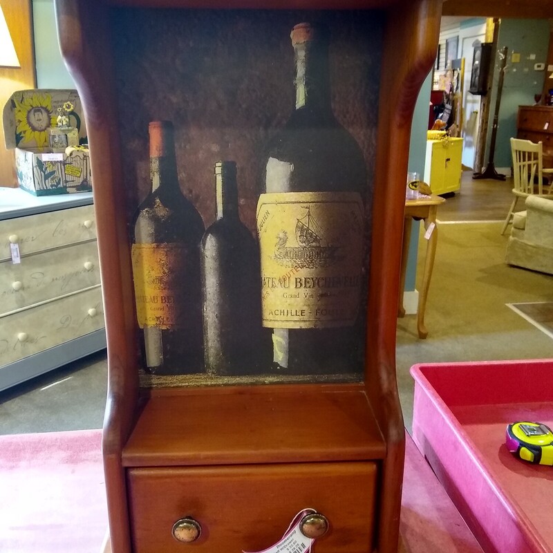 Wood Shelf W/Drawer

Standing wood shelf with wine bottle background.  Shelf has pullout drawer.

Size: 13 in wide X 6 in deep X 22 in high