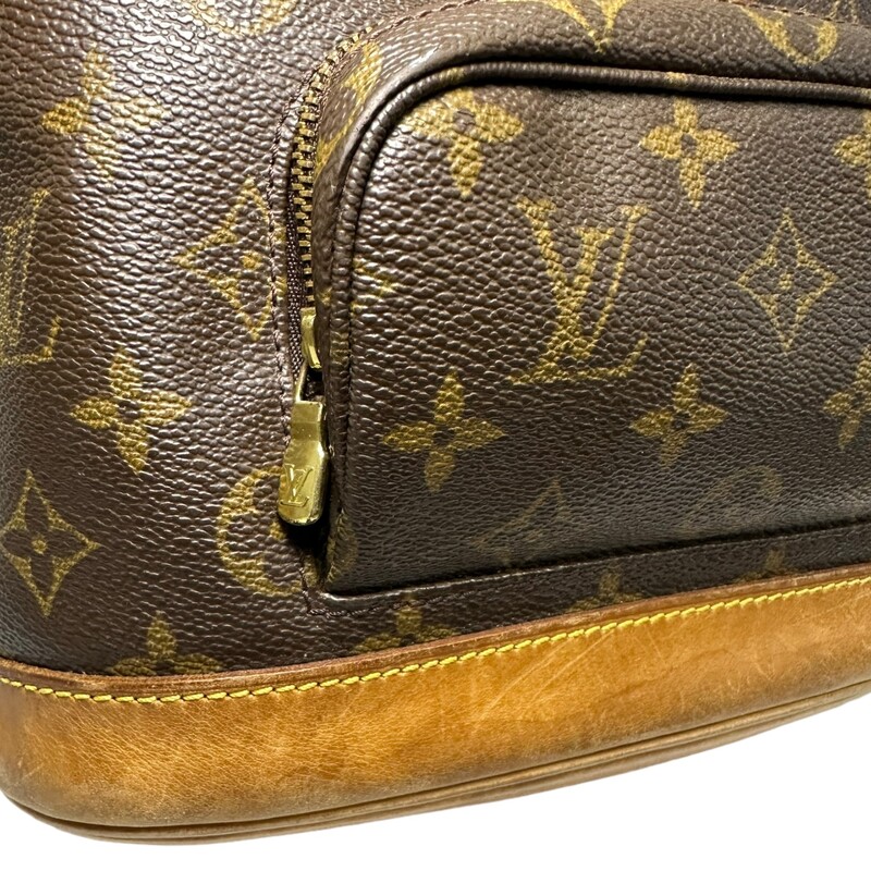 LOUIS VUITTON Monogram Montsouris Backpack. This versatile backpack is crafted of classic monogram coated canvas. The bag features a front zipper pocket, and natural vachetta cowhide leather trim including the base, top handle, and adjustable backpack straps. The bag opens with a belt buckle to a cocoa brown fabric interior.

Dimensions:
Base length: 8 in
Height: 9 in
Width: 4 in
Drop: 2 in
Drop: 14 in

Code: SP0020