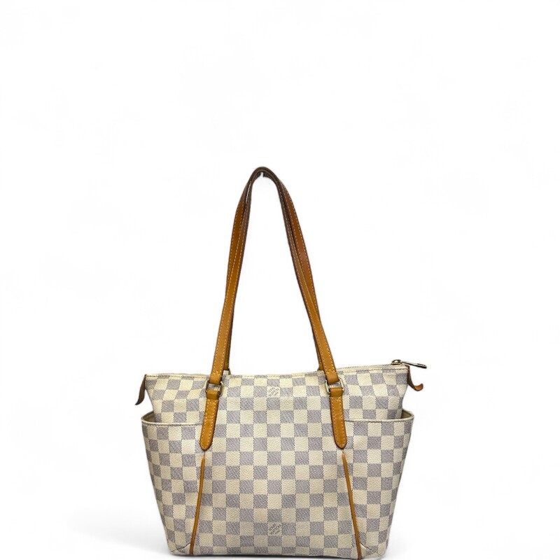 LOUIS VUITTON Damier Azur Totally PM. This stylish tote is crafted of Louis Vuitton's signature checkerboard coated canvas in blue and white. The bag features side slip pockets, vachetta cowhide leather shoulder straps and trim, and gold-plated hardware. The top zipper opens to an ivory fabric interior with patch pocket

Dimensions:
Base length: 11 in
Height: 9.75 in
Width: 5.5 in
Drop: 9.25 in

Date Code:
SD4186