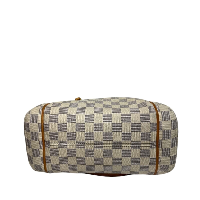 LOUIS VUITTON Damier Azur Totally PM. This stylish tote is crafted of Louis Vuitton's signature checkerboard coated canvas in blue and white. The bag features side slip pockets, vachetta cowhide leather shoulder straps and trim, and gold-plated hardware. The top zipper opens to an ivory fabric interior with patch pocket

Dimensions:
Base length: 11 in
Height: 9.75 in
Width: 5.5 in
Drop: 9.25 in

Date Code:
SD4186