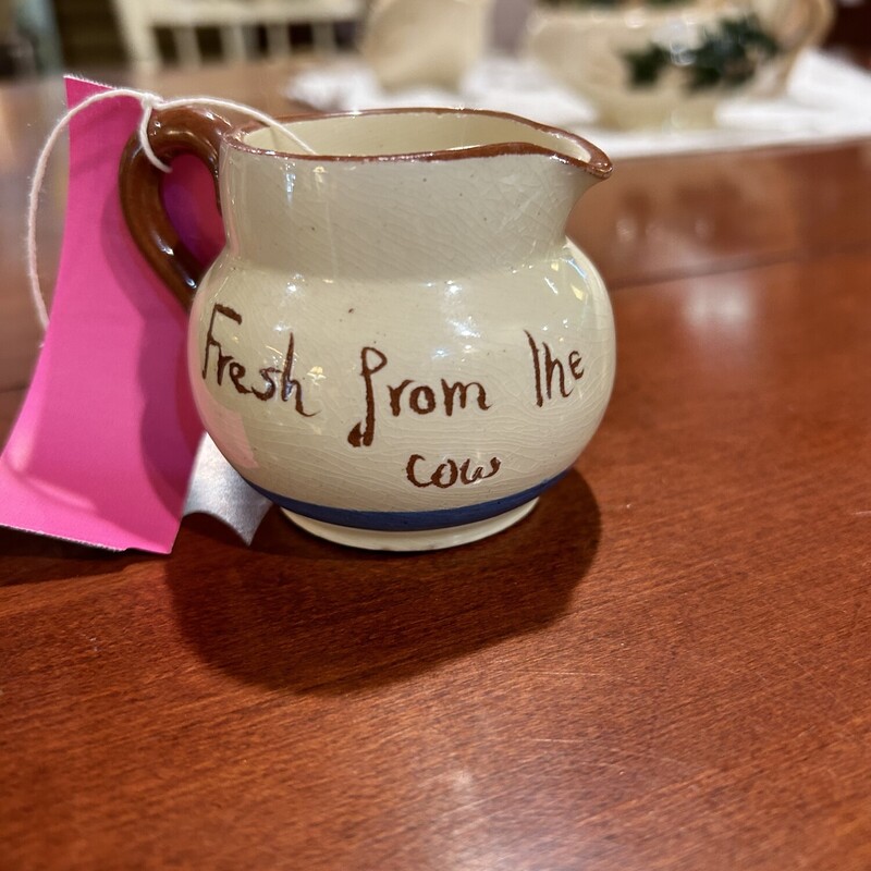 Watcombe Cheddar Pitcher<br />
Size: 2 In T<br />
Watcombe Tourquay creamer.  One side has a cottage with the word Cheddar and the other side says Fresh From The Cow.  There are three pieces available - all sold sepqrately.