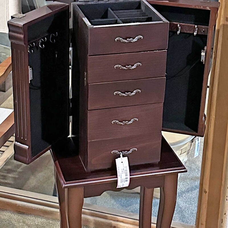 Jewelry Armoire,
 Size: 12x9x34
Great standing jfewelry armoire with 5 drawer, lift top for more storage and 2 swing doors for necklaces  Great gift idea!  In very good condition