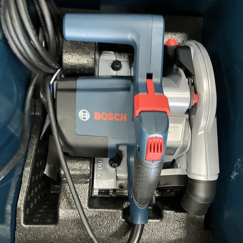 Track Saw, Bosch,<br />
BOSCH Tools Track Saw - GKT13-225L 6-1/2 In. Precison Saw with Plunge Action & Carrying Case<br />
<br />
The Bosch GKT13-225 Track Saw with Plunge Action delivers precision and power, ideal for making table-saw quality cuts to wood and wood-based sheet goods such as laminated particle boards and plywood. The track-guidance system provides exact adjustments for precision end-to-end cuts and plunge cuts. The saw and track combination makes it a more easily transportable alternative to a table saw. The precision of the track saw and blade combine with the optional Bosch tracks (included) to deliver a straight fast finish cuts. The saw is engineered to fit precisely to the tracks. The saw includes constant electronics to help maintain speed under load. The saw also features a spindle lock, a swiveling hose port and a lock-off mechanism. It features overload protection. It has a single pivot point for both bevel and non-bevel cuts, from -1° (for slight undercuts) to +47° cuts. It allows for efficient dust extraction when connected to a suitable vacuum cleaner. The GKT13-225L Kit includes a 48-tooth 6-1/2 In. track saw blade, blade-change wrench, and an L-Box case. Bosch offers a full range of optional attachments, including four different track lengths, connector for connecting multiple tracks, an angle guide and a rip fence.