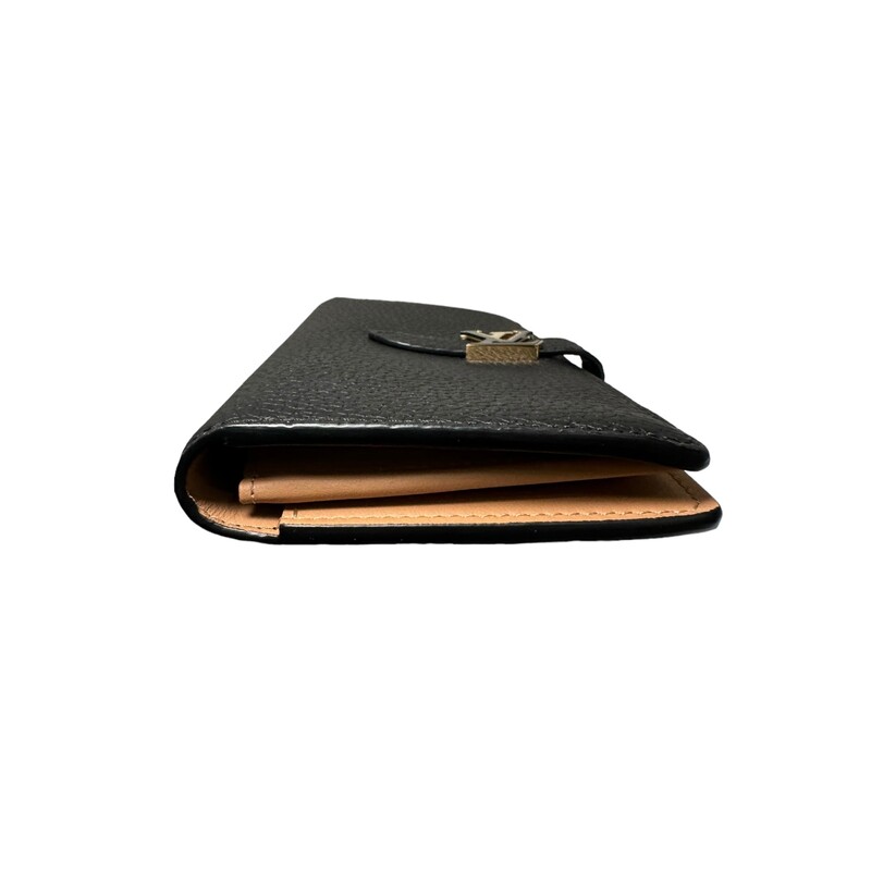 Louis Vuitton Capucines Bifold Wallet<br />
<br />
Dimensions:<br />
3.9 x 7.5 x 0.7 inches<br />
(length x Height x Width)<br />
<br />
Date Code: Chipped<br />
<br />
The LV Vertical wallet is an elegant design crafted from soft, grained Taurillon leather. It opens to reveal a contrasting lining, as well as eight card slots, a zipped coin pocket and a large, V-shaped slot for tickets and bills. This wallet features a distinctive sliding closure with an LV Initials accessory inspired by the iconic Capucines bag.