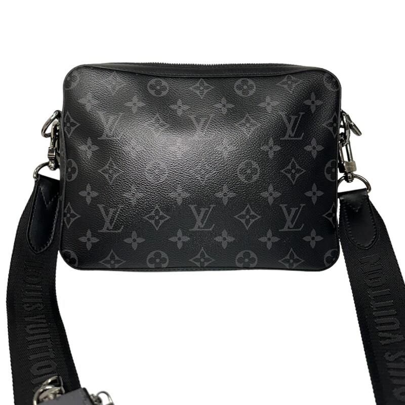 Louis Vuitton Trio Messenger<br />
<br />
Dimensions:<br />
9.8 x 7.3 x 2.8 inches<br />
(length x Height x Width)<br />
15.5-24.5 strap drop<br />
<br />
Date Code: Chipped<br />
<br />
The Trio Messenger bag from Monogram Eclipse canvas and its mirror twin, Monogram Eclipse Reverse. The iconic motif in tone-on-tone shades of gray complements the lines of this functional hybrid. More than a traditional cross-body bag, it has a removable zipped pocket and a removable coin purse attached to the strap