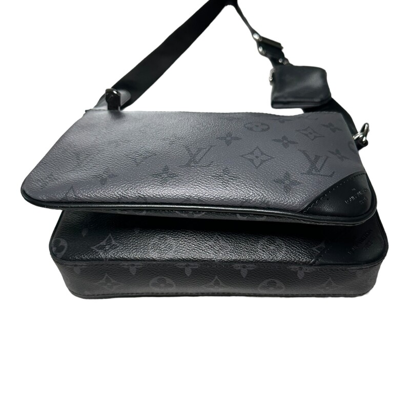 Louis Vuitton Trio Messenger<br />
<br />
Dimensions:<br />
9.8 x 7.3 x 2.8 inches<br />
(length x Height x Width)<br />
15.5-24.5 strap drop<br />
<br />
Date Code: Chipped<br />
<br />
The Trio Messenger bag from Monogram Eclipse canvas and its mirror twin, Monogram Eclipse Reverse. The iconic motif in tone-on-tone shades of gray complements the lines of this functional hybrid. More than a traditional cross-body bag, it has a removable zipped pocket and a removable coin purse attached to the strap