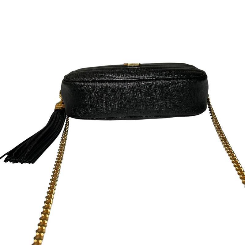 SAINT LAURENT Grain De Poudre Matelasse Monogram Mini Lou Camera Bag in Black. This shoulder bag is crafted of chevron-quilted calfskin leather in black. The bag features a gold chain link shoulder strap with a leather shoulder pad, and a matching gold YSL monogram detail on the front. The tasseled wrap-around zipper opens to a compact black leather interior with card slots.
Style Code: GNC 612579
Dimensions:
 Length: 7.5 in
Height: 4.75 in
Width: 1.75 in
Drop: 22 in