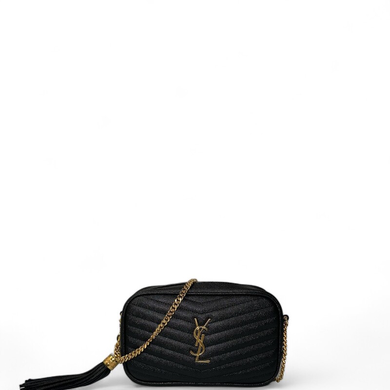 SAINT LAURENT Grain De Poudre Matelasse Monogram Mini Lou Camera Bag in Black. This shoulder bag is crafted of chevron-quilted calfskin leather in black. The bag features a gold chain link shoulder strap with a leather shoulder pad, and a matching gold YSL monogram detail on the front. The tasseled wrap-around zipper opens to a compact black leather interior with card slots.
Style Code: GNC 612579
Dimensions:
 Length: 7.5 in
Height: 4.75 in
Width: 1.75 in
Drop: 22 in