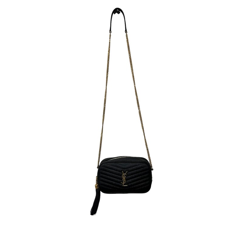 SAINT LAURENT Grain De Poudre Matelasse Monogram Mini Lou Camera Bag in Black. This shoulder bag is crafted of chevron-quilted calfskin leather in black. The bag features a gold chain link shoulder strap with a leather shoulder pad, and a matching gold YSL monogram detail on the front. The tasseled wrap-around zipper opens to a compact black leather interior with card slots.
Style Code: GNC 612579
Dimensions:
 Length: 7.5 in
Height: 4.75 in
Width: 1.75 in
Drop: 22 in