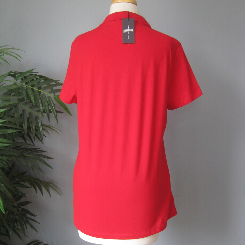 Red Heritage Polo from Tommy Hilfiger<br />
Brand new with tags.<br />
reinforced slits at the sides<br />
size Large<br />
94% cotton, 6% spandex, extra button included<br />
flat measurements:<br />
shoulder to shoulder : 15.5<br />
armpit to armpit: 19.75<br />
width: 21<br />
length: 25<br />
thanks for looking!<br />
#73995