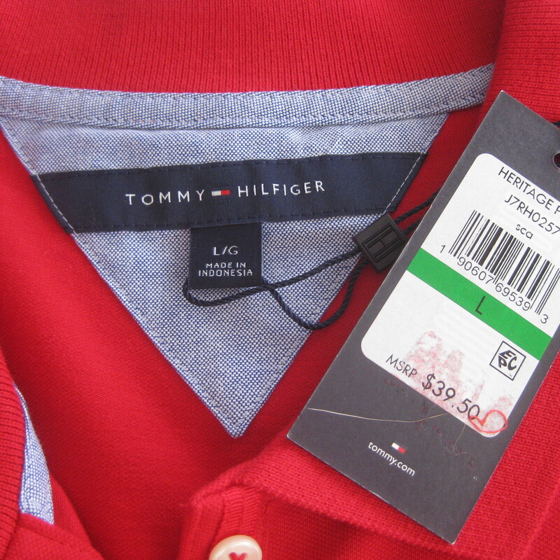 Red Heritage Polo from Tommy Hilfiger<br />
Brand new with tags.<br />
reinforced slits at the sides<br />
size Large<br />
94% cotton, 6% spandex, extra button included<br />
flat measurements:<br />
shoulder to shoulder : 15.5<br />
armpit to armpit: 19.75<br />
width: 21<br />
length: 25<br />
thanks for looking!<br />
#73995