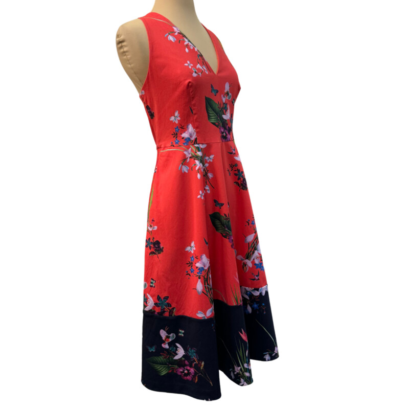 Ted Baker Eselle Floral Dress<br />
Butterfly and Flower Print<br />
Adjustable Straps<br />
Cotton Blend<br />
With Pockets<br />
Color:  Geranium Red, Navy, and Colorful Flowers and Butterflies<br />
Size: US Size: 8-10 Ted Baker Size: 4