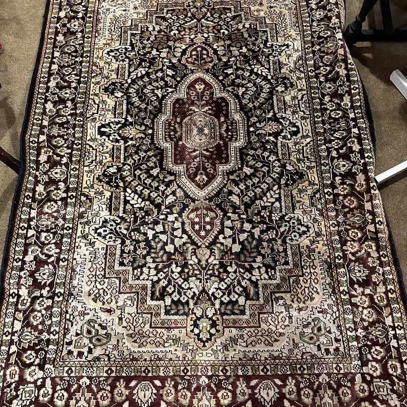Silk On Wool Tabriz,
Size: 47x70
A beautiful silk on wool Tabriz rug in very good conditon.  There is a thin black border with red/black /beige/green design in the interior.  The rug has such a luxurious feel and the colors change in different lights.