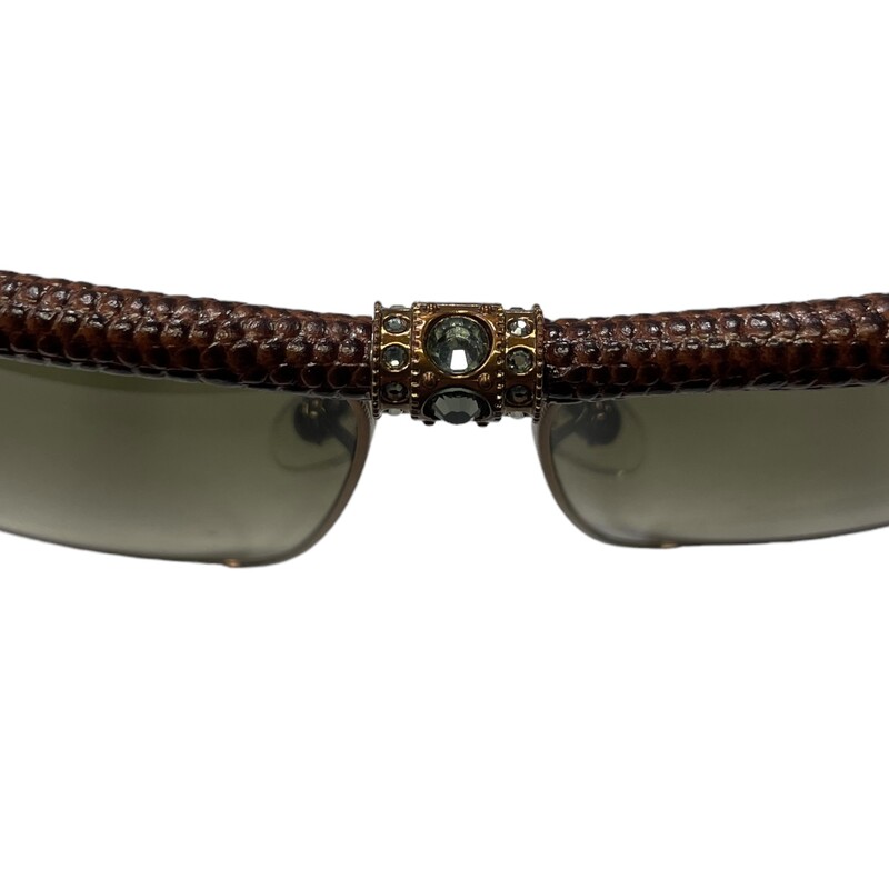 Lanvin SLN001 Textured<br />
<br />
Reptile Scales Framed Sunglasses<br />
Lenses have a gradient tint that starts dark at the top and gradually lightens towards the bottom<br />
The length of the temple pieces are 135 millimeters<br />
The width of the bridge of this frame is 13 millimeters<br />
The lens are 62 millimeters at the largest point<br />
Compatible with bi-focal, progressive lenses, or prescription lens installation<br />
Composed of metal like nickel, monel, or stainless steel to help give some durability and relative overall strength<br />
Fully rimmed along the edges<br />
<br />
Please Note: there are some faint, minor scratches on the lens