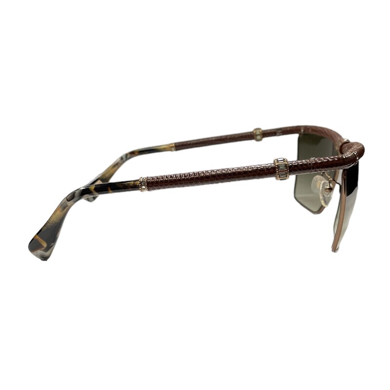 Lanvin SLN001 Textured<br />
<br />
Reptile Scales Framed Sunglasses<br />
Lenses have a gradient tint that starts dark at the top and gradually lightens towards the bottom<br />
The length of the temple pieces are 135 millimeters<br />
The width of the bridge of this frame is 13 millimeters<br />
The lens are 62 millimeters at the largest point<br />
Compatible with bi-focal, progressive lenses, or prescription lens installation<br />
Composed of metal like nickel, monel, or stainless steel to help give some durability and relative overall strength<br />
Fully rimmed along the edges<br />
<br />
Please Note: there are some faint, minor scratches on the lens